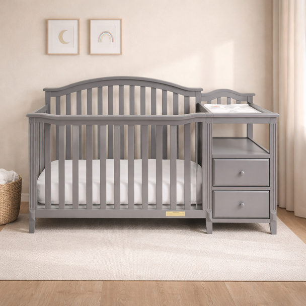 Gray crib with changing table in a nursery setting