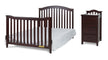 Dark wood crib and matching dresser on a white background