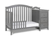 Gray crib with changing table on a white background