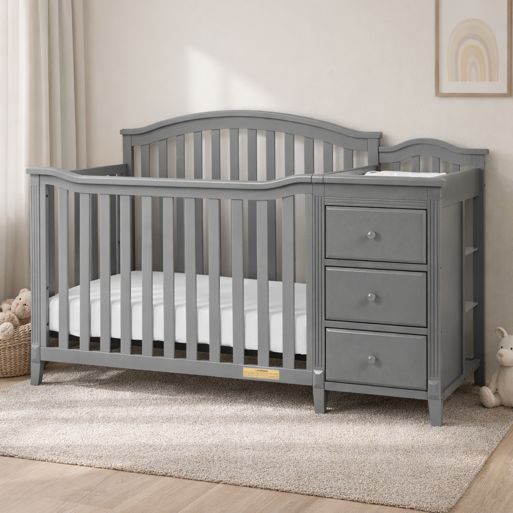 Gray crib with changing table in a nursery setting
