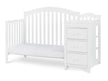 White crib with drawers on a white background