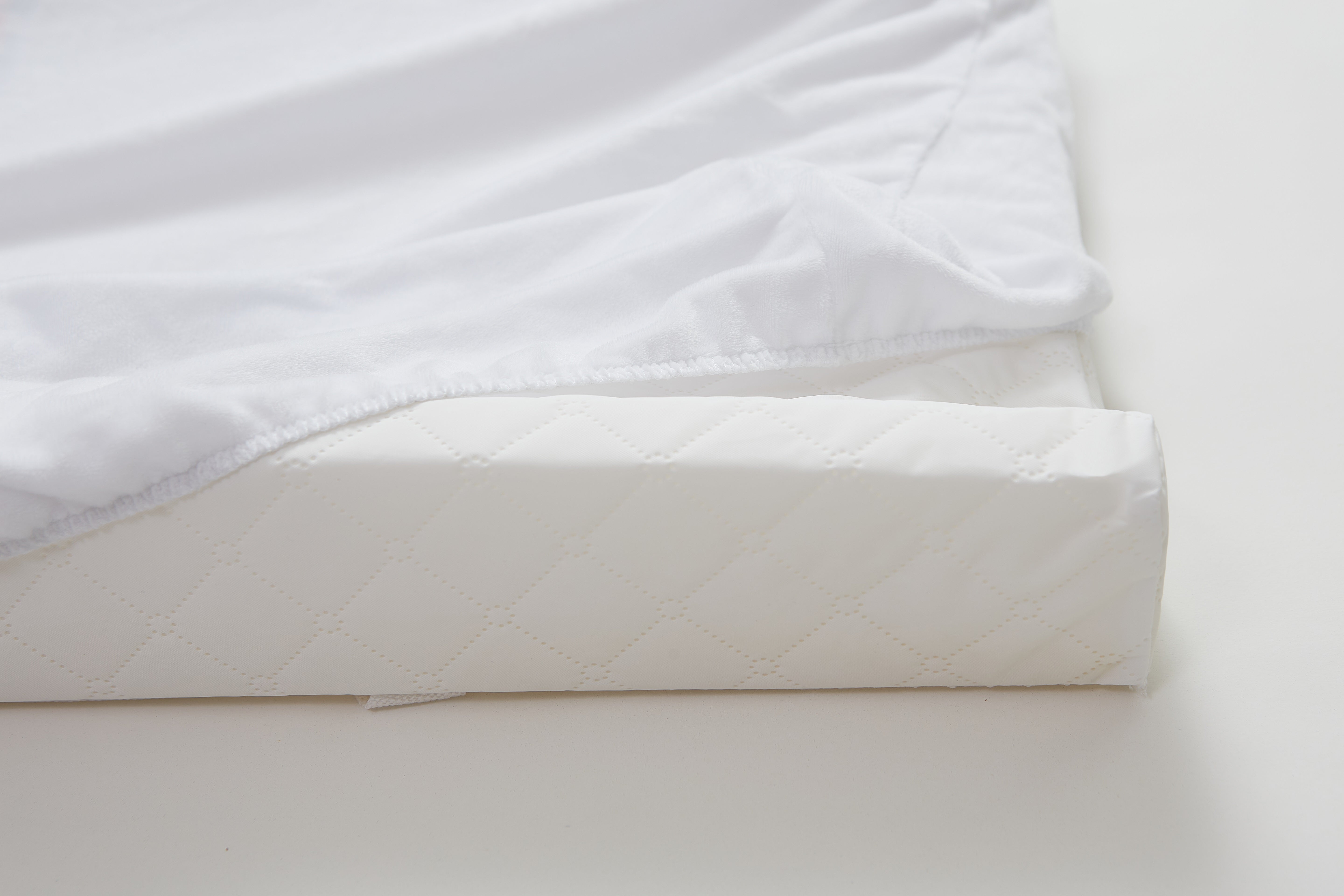 Contoured changing pad in a nursery setting