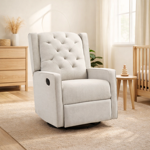 Light gray recliner chair in a nursery setting with wooden furniture and decor.